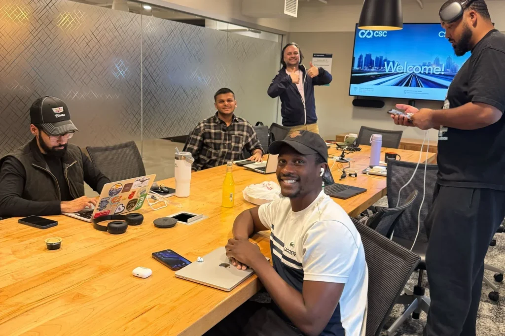 Team working together around a conference table during a working session
